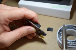 Soldering headers using your finger to hold it in alignment.